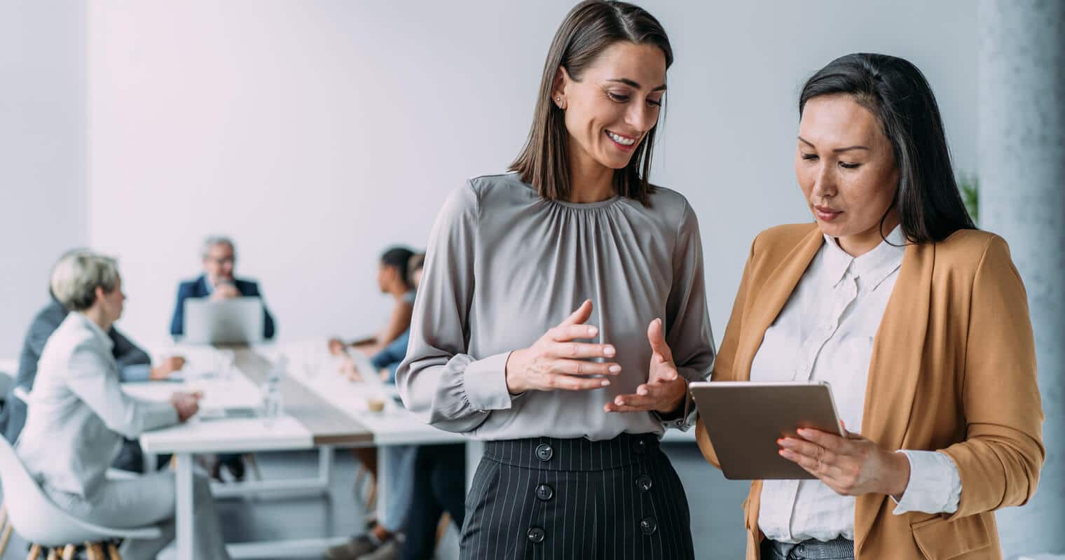 Two businesswomen learning data concepts like "what is an exabyte."